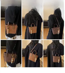 Multiple views of a vintage leopard print mini bucket bag with tassel charm detail