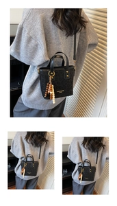 Detail view of leopard print bucket bag with beaded tassels and gold hardware accents