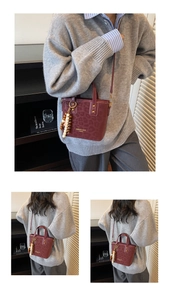 Detail of burgundy leopard embossed handbag with unique wooden bead tassel and crossbody strap