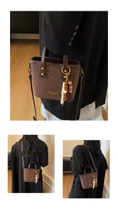 Detail of coffee leopard print bucket bag with vintage wooden beaded tassel charm