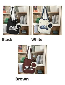 Detail of the large nylon tote bag and matching round coin purse in multiple colors