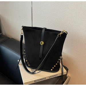 Fashionable black faux leather bucket bag with gold rivets and business styling
