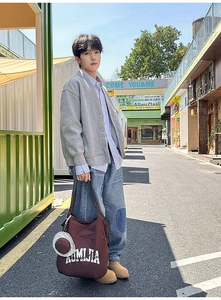 Deep brown canvas tote bag styled with casual V-neck cardigan and washed denim jeans