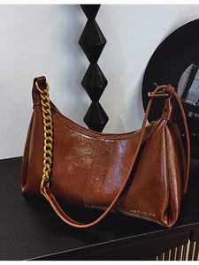 Dark brown oil wax leather shoulder bag with vintage gold chain strap and slouchy design