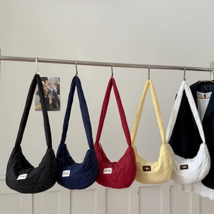 Detailed heart-shaped quilting pattern on nylon dumpling bags in multiple colors
