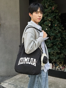 Black large capacity nylon tote bag with KUMIJA logo and mini hat coin purse accessory