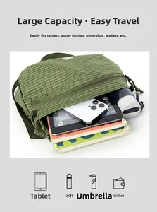 Detailed internal view of green checkered crossbody bag with large capacity storage
