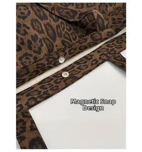 Close-up of secure magnetic snap closure on a leopard print tote bag interior
