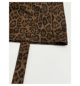 Detailed macro view of leopard print tote bag fabric with precision stitching and soft texture