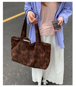 Close-up of large leopard print tote bag showing canvas texture and spacious design