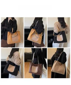 Detailed view of spacious canvas tote bags with metal chain straps in multiple colors