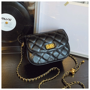Close-up of black quilted leather bag featuring gold ball chain adjuster and metal clasp