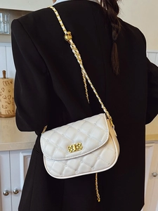 Chic beige quilted crossbody bag with gold chain strap and elegant metal twist lock closure
