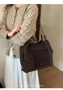 Minimalist retro dark brown suede tote bag styled with a creamy cable knit sweater