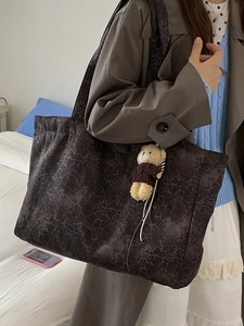 Large leopard print tote bag with plush bear charm, stylish commuter shoulder handbag