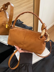 Retro caramel brown suede handbag for women featuring a stylish gold chain decoration
