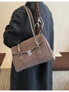 Retro brown frosted suede shoulder bag shown on model with warm vintage aesthetic