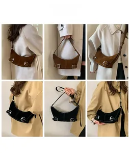 Detail shots of suede half-moon bags in dark brown and black with silver buckles