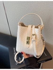 Chic cream white woven leather bucket bag with golden buckle and adjustable strap