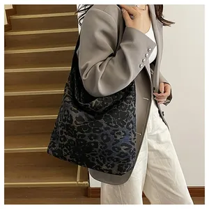 Detail of large leopard print tote bag with soft texture for women commute style