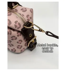 Detail of pink leopard print bag with detachable golden alloy hardware hook
