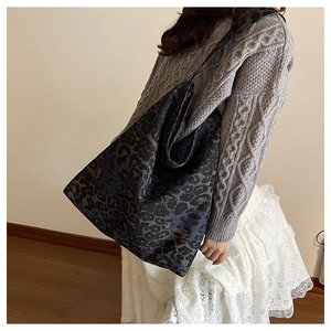 Fashionable leopard print tote bag shown on model to highlight large capacity and style