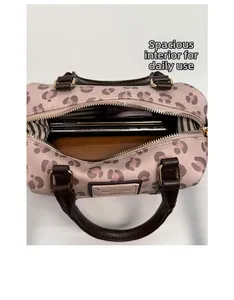 Top view showing the large interior capacity of this pink leopard print boston bag