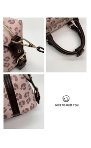Detailed views of pink leopard print handbag featuring brown leather handles and gold hardware