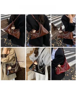 Multiple views showing the stylish tote bag worn in various settings with metal chain detail