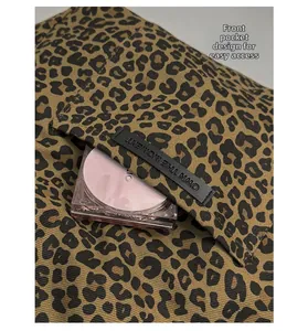 Detailed view of leopard print tote bag front pocket with quick access for small items