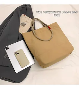 Tote bag size comparison showing spacious interior for iPad and daily essentials