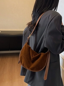 Retro brown suede crescent shoulder bag with adjustable strap for a minimalist style