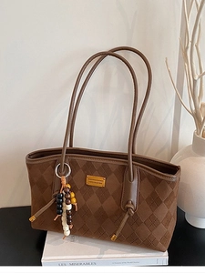 Vintage brown quilted suede tote bag with metallic logo plate and beaded charm decoration