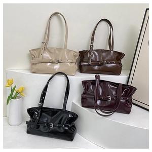 Detailed view of fashionable tote bags in four elegant colors on minimalist pedestals
