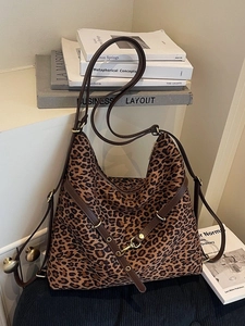 Leopard print bucket bag with brown faux leather strap and large capacity design