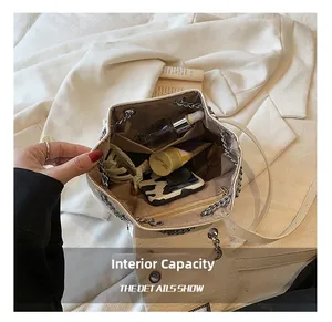 Top view of white leather bucket bag interior showing spacious storage for daily essentials