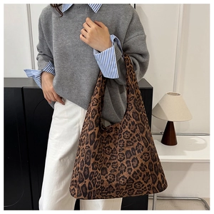 Detail of large leopard print tote bag showing soft fabric texture and ample storage space