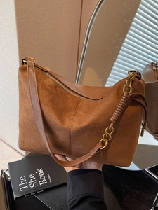 Retro caramel suede hobo bag with vintage gold hardware and woven leather shoulder strap