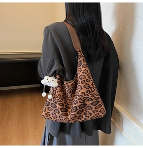 Leopard print suede tote bag with brown leather strap and cloud charm detail