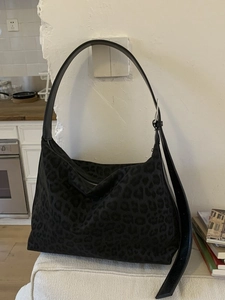 Large capacity crescent bag featuring subtle dark leopard print and adjustable shoulder strap