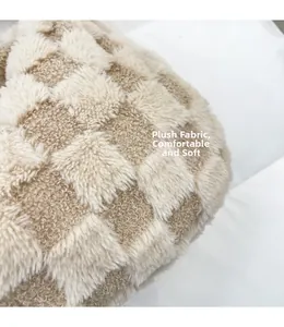 Detail of plush checkerboard fabric showing soft texture and beige plaid pattern