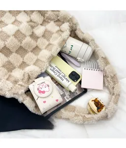 Detailed view of large plush checkered tote bag showing spacious internal storage capacity