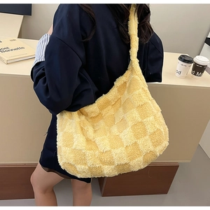 Detail view of the soft yellow and beige checkered plush texture on large tote bag