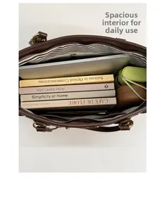 Deep brown leather tote interior view showing large capacity for laptop and books