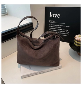 Detail view of the deep brown suede Hobo bag with adjustable leather strap and silver buckle