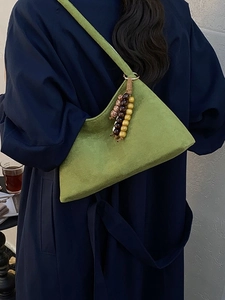 Minimalist grass green suede shoulder bag with retro wooden bead charm for women