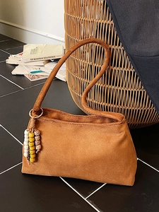 Retro brown suede shoulder bag for women with decorative beaded fringe and slim strap