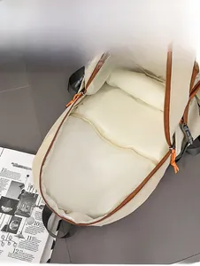 Detail view of contrast color backpack internal structure with laptop compartment