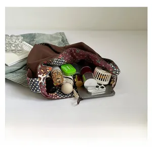 Detail of large canvas tote bag showing interior contrast lining and spacious storage
