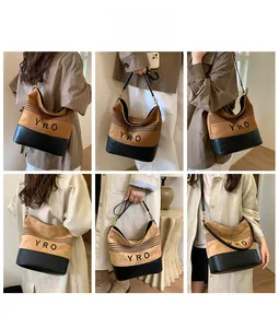 Detailed views of vintage brown suede tote with black quilted base and YRO logo strap